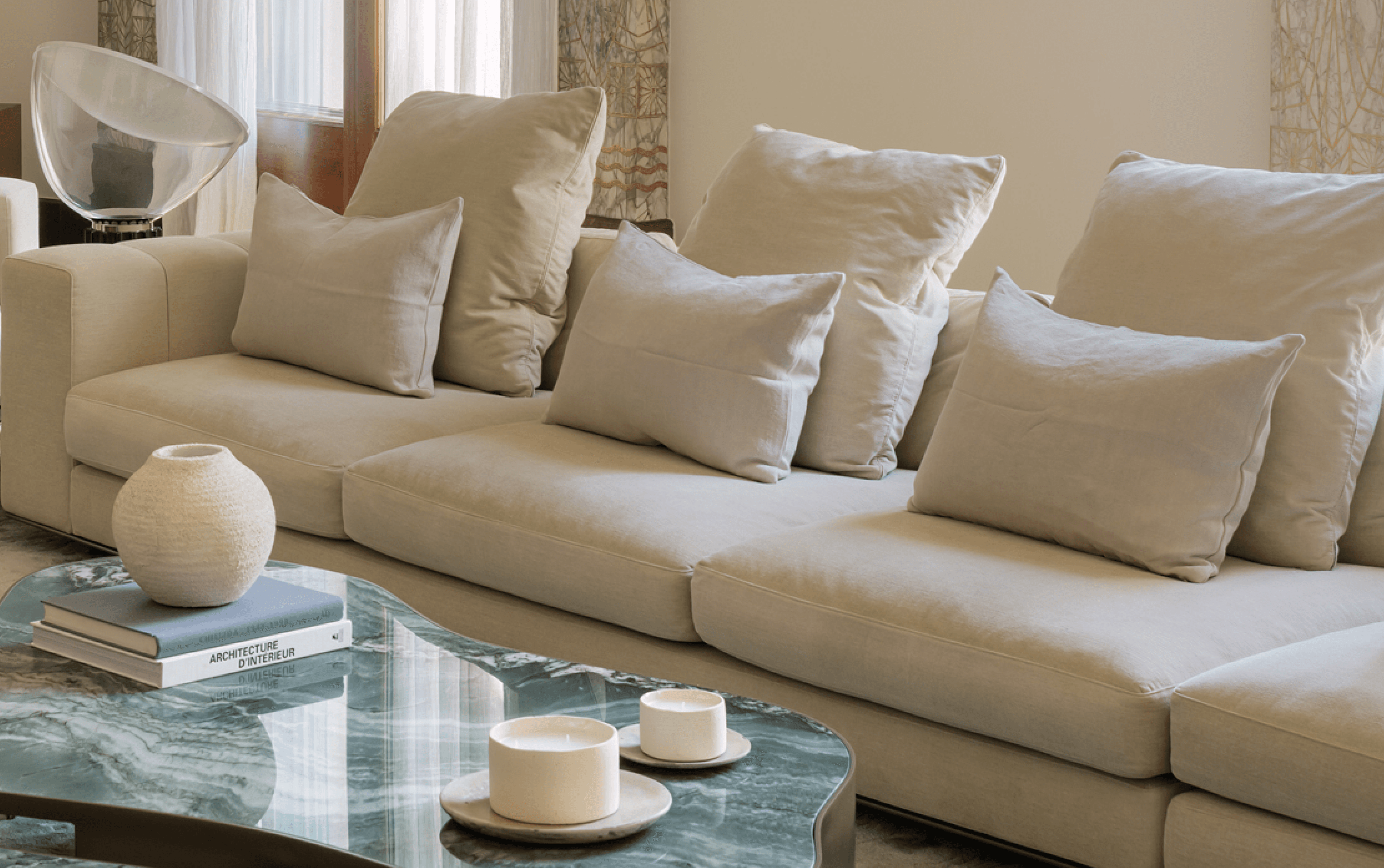 Beige sofa with soft cushions and marble coffee table · LUV Lifestyle Decoration & Styling