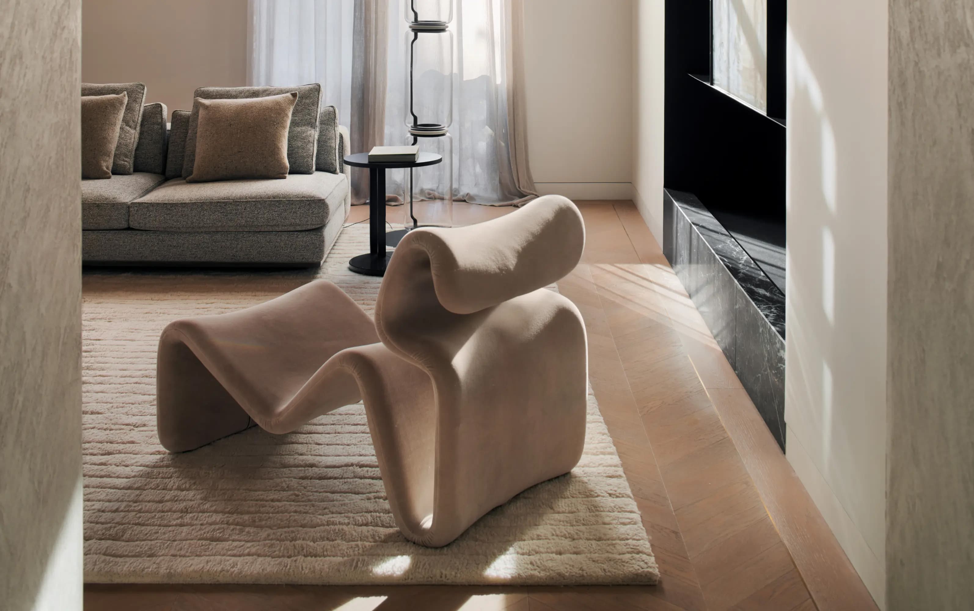 Modern sculptural lounge chair with organic curves · LUV Lifestyle FF&E