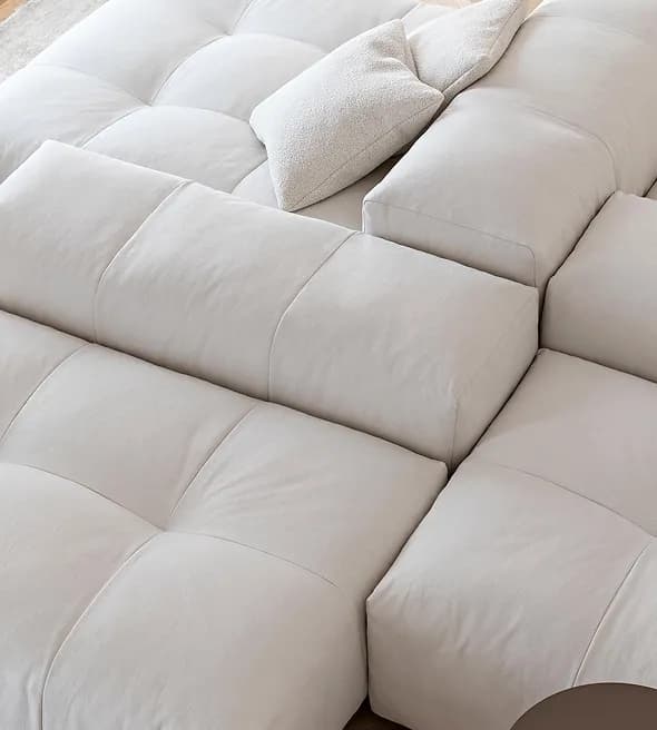 Oversized modular sofa with soft quilting and neutral upholstery