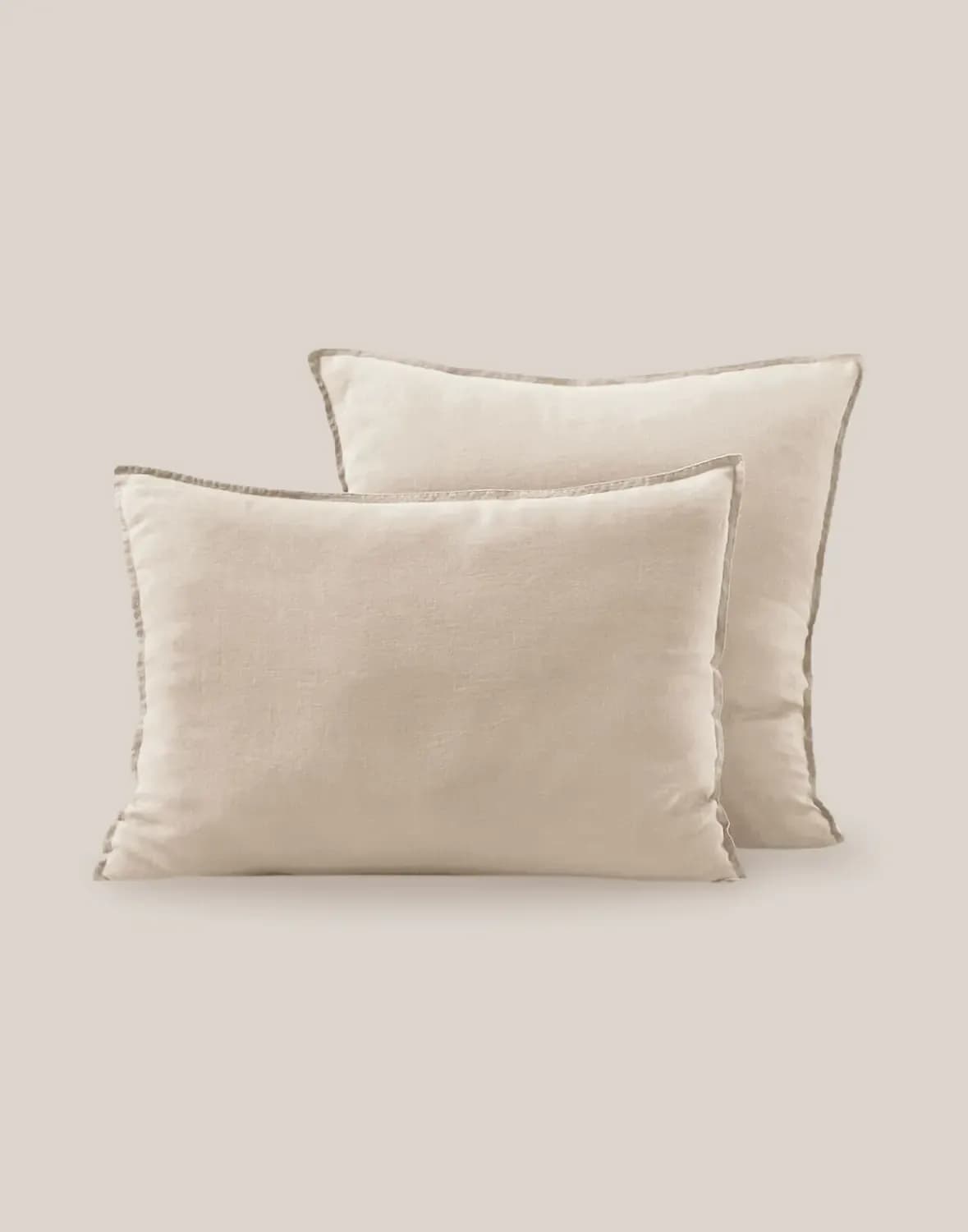 Pair of neutral linen cushions on soft background · LUV Lifestyle Decoration & Styling