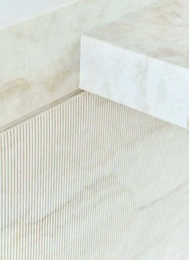 Close-up of textured premium marble surface · LUV Lifestyle Quality Upgrade