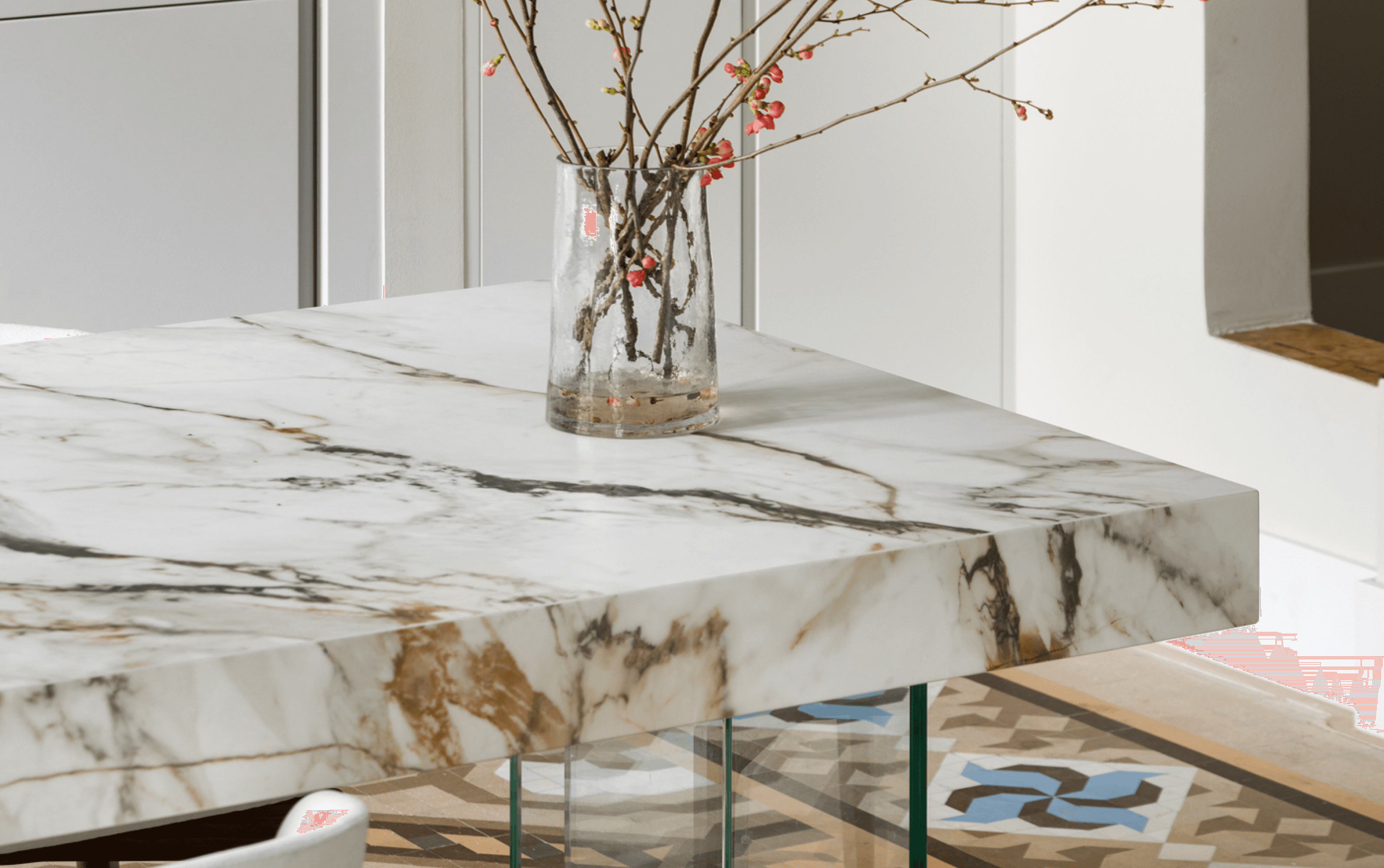 Marble kitchen island with glass vase and patterned floor · LUV Lifestyle Quality Upgrade