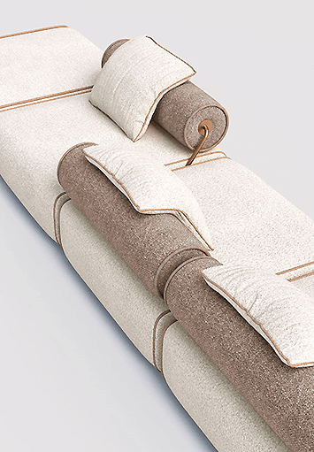 Contemporary modular daybed in beige and taupe bouclé fabric with brass details, minimalist design on neutral background.