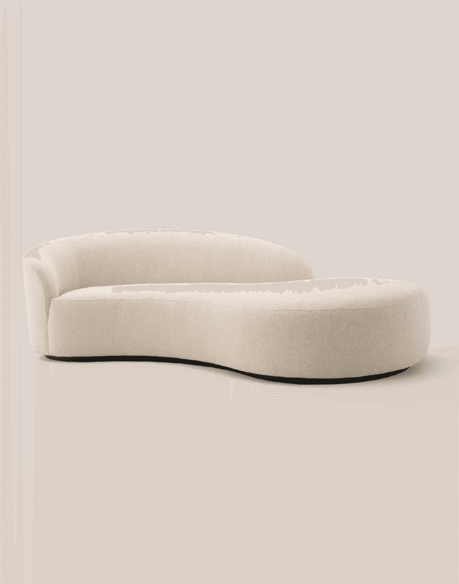Curved beige sofa in a refined interior with decorative details · LUV Lifestyle FF&E