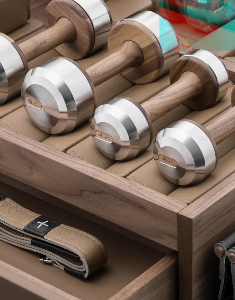 Luxury dumbbells in wood and stainless steel stored in a crafted box